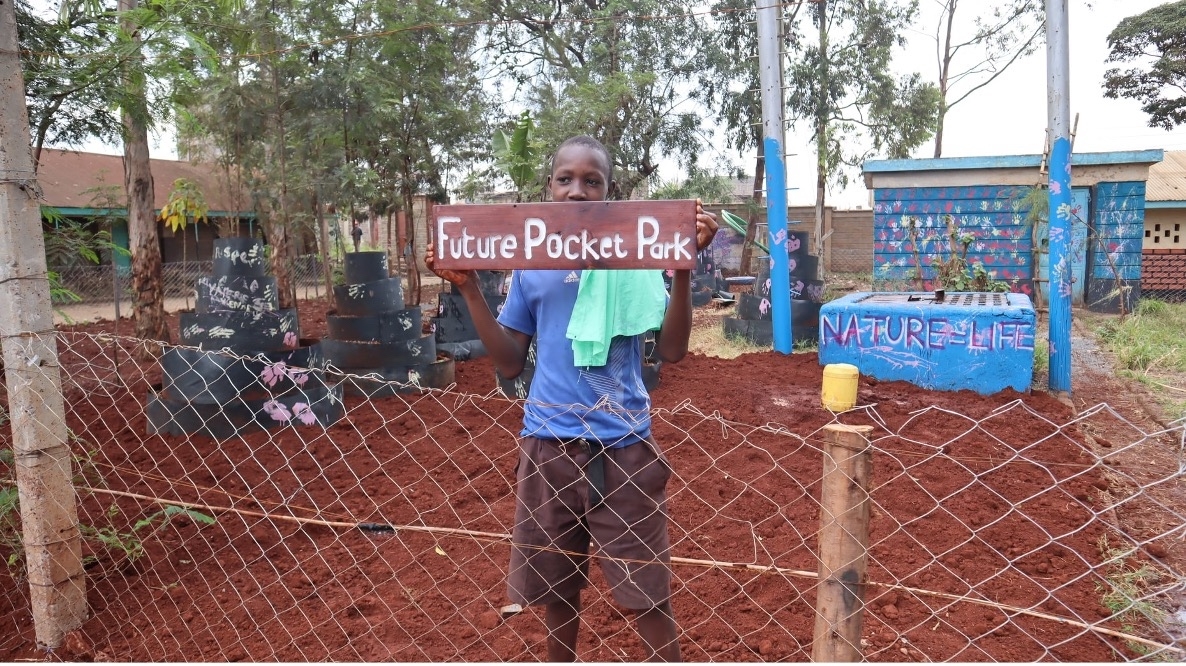 Child in a Carbon Sink Pocket Park created by Hope raisers in Kenya. Photo: Hope Raisers